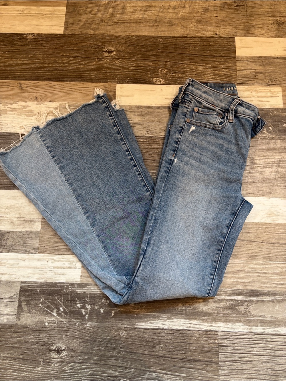 American Eagle Outfitters Light Blue Flare Jeans with Frayed Hem